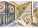 Inviting front porch with chairs, wreaths, and decorative star, creating a cozy entrance at 66 Goldrush Ne Cir, Atlanta, GA 30328