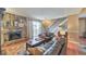 Comfortable living room features a stone fireplace, sliding glass doors to a balcony, and cozy furnishings at 66 Goldrush Ne Cir, Atlanta, GA 30328