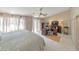 Large main bedroom with vaulted ceiling, fan, desk, and outdoor access at 66 Goldrush Ne Cir, Atlanta, GA 30328