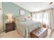 Bright main bedroom with cool color scheme, king size bed, lamps, and bedside tables at 66 Goldrush Ne Cir, Atlanta, GA 30328