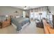 Serene bedroom with a king bed, plush carpeting, large windows, and sitting area at 66 Goldrush Ne Cir, Atlanta, GA 30328