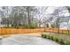 Spacious backyard with a concrete patio and a tall wooden fence for privacy at 1593 Roswell Se St, Smyrna, GA 30080