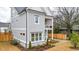 Side view of a two-story home with a double porch, showcasing its well-maintained exterior at 1593 Roswell Se St, Smyrna, GA 30080