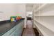 Spacious pantry featuring modern cabinets, dark countertops and built-in shelving at 2145 Mountclaire Ct, Stone Mountain, GA 30087