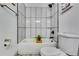 Bright bathroom featuring a tub and shower combination with modern tiled walls at 236 Barfield Sw Ave, Atlanta, GA 30310