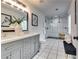 Elegant bathroom features a double vanity and a modern shower with bench seating at 236 Barfield Sw Ave, Atlanta, GA 30310
