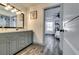 Stylish bathroom featuring modern vanity, updated fixtures, and plank-style flooring at 236 Barfield Sw Ave, Atlanta, GA 30310