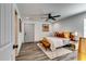 Bright bedroom featuring modern ceiling fan, stylish furnishings, with plank flooring at 236 Barfield Sw Ave, Atlanta, GA 30310
