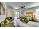 Bright bedroom boasts a private deck, ceiling fan, and stylish furnishings at 236 Barfield Sw Ave, Atlanta, GA 30310