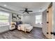 Bright bedroom featuring modern ceiling fan, stylish furnishings, and natural light at 236 Barfield Sw Ave, Atlanta, GA 30310