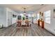 Open-concept dining room and kitchen with modern cabinetry, stainless steel appliances, and stylish lighting at 236 Barfield Sw Ave, Atlanta, GA 30310