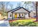 Charming renovated home with a bright yellow door and covered front porch, perfect for relaxing at 236 Barfield Sw Ave, Atlanta, GA 30310