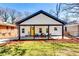 Beautifully renovated home featuring a welcoming front porch with outdoor seating at 236 Barfield Sw Ave, Atlanta, GA 30310
