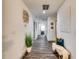 Hallway featuring modern decor, neutral paint, and wood-look flooring leading to other areas of the home at 236 Barfield Sw Ave, Atlanta, GA 30310