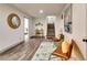 Spacious hallway with wood-look flooring, stylish decor, and staircase access to upper floors at 236 Barfield Sw Ave, Atlanta, GA 30310