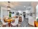 Bright kitchen with white cabinetry, stainless steel appliances, and a view to the dining area at 236 Barfield Sw Ave, Atlanta, GA 30310