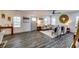 Bright and airy living room showcasing hardwood floors, neutral decor, and ample natural light at 236 Barfield Sw Ave, Atlanta, GA 30310