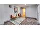 Cozy sitting area featuring modern chairs, art, and stylish decor, with wood-look flooring at 236 Barfield Sw Ave, Atlanta, GA 30310