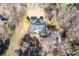 Stunning aerial view of home with a circular driveway, and landscaping set amongst a lush wooded area at 25 Sherman Nw Ln, Cartersville, GA 30121