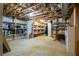 Unfinished basement with exposed ceiling, concrete floor, shelving, and ample storage space at 25 Sherman Nw Ln, Cartersville, GA 30121