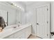 Well-lit bathroom with a vanity, white cabinets, a large mirror, and modern fixtures at 25 Sherman Nw Ln, Cartersville, GA 30121