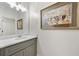 Bathroom with gray vanity, white countertop, and large framed art piece at 25 Sherman Nw Ln, Cartersville, GA 30121