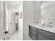 Stylish bathroom featuring a grey vanity with white countertop and a mosaic tile floor at 25 Sherman Nw Ln, Cartersville, GA 30121