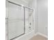 Bathroom featuring a glass-enclosed shower and tub combination at 25 Sherman Nw Ln, Cartersville, GA 30121