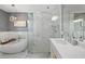 Bright bathroom featuring a standalone tub and glass-enclosed shower at 25 Sherman Nw Ln, Cartersville, GA 30121