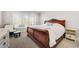 Bedroom with a large window, a decorative sleigh bed, and soft, neutral decor at 25 Sherman Nw Ln, Cartersville, GA 30121