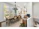 Bright dining area adjacent to kitchen featuring a wooden table, chandelier, and lots of light at 25 Sherman Nw Ln, Cartersville, GA 30121