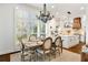 An eat-in kitchen and dining area features lots of natural light and a wooden table and chairs at 25 Sherman Nw Ln, Cartersville, GA 30121