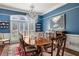 Formal dining room with a chandelier, blue walls, and an elegant wood table at 25 Sherman Nw Ln, Cartersville, GA 30121