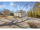 Beautiful home exterior with a circular driveway, manicured landscaping, and mature trees at 25 Sherman Nw Ln, Cartersville, GA 30121