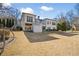 Rear exterior view of a two-story home with a large backyard and patio area at 25 Sherman Nw Ln, Cartersville, GA 30121