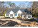 Charming single-story home with manicured lawn, blue door and dark shutters at 25 Sherman Nw Ln, Cartersville, GA 30121