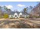 Charming single-story home with manicured lawn, blue door and dark shutters at 25 Sherman Nw Ln, Cartersville, GA 30121
