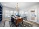 Home office featuring bright windows, a wooden desk, and a beautiful chandelier at 25 Sherman Nw Ln, Cartersville, GA 30121
