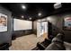 A home theater features comfortable black leather seating, a large screen, and film-themed decor at 25 Sherman Nw Ln, Cartersville, GA 30121