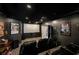A home theater features comfortable black leather seating, a large screen, and film-themed decor at 25 Sherman Nw Ln, Cartersville, GA 30121