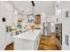Bright kitchen featuring stainless appliances, white cabinets, and a large center island at 25 Sherman Nw Ln, Cartersville, GA 30121