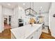 Open concept kitchen with marble island, stainless appliances, and access to a dining area at 25 Sherman Nw Ln, Cartersville, GA 30121