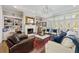 Elegant living room featuring fireplace, built-in shelving, and hardwood floors at 25 Sherman Nw Ln, Cartersville, GA 30121