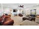 Bright living room featuring a comfortable sectional sofa, leather seating, and natural light at 25 Sherman Nw Ln, Cartersville, GA 30121