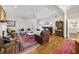 Elegant living room with hardwood floors, chandelier, fireplace and large windows at 25 Sherman Nw Ln, Cartersville, GA 30121