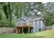 Backyard view featuring a deck and steps with a wood fence surround at 833 N Grand Nw Ave, Atlanta, GA 30318