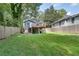 Backyard view featuring a deck and steps with a wood fence surround at 833 N Grand Nw Ave, Atlanta, GA 30318