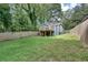 Backyard view featuring a deck and steps with a wood fence surround at 833 N Grand Nw Ave, Atlanta, GA 30318