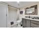 Full bathroom with vanity and shower/tub combo at 833 N Grand Nw Ave, Atlanta, GA 30318