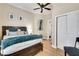 Comfortable bedroom with light hardwood flooring, ceiling fan, and closet at 833 N Grand Nw Ave, Atlanta, GA 30318